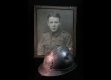 Photo of WWI helmet; framed photo of Kent Hagler