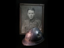 Photo of WWI helmet; framed photo of Kent Hagler